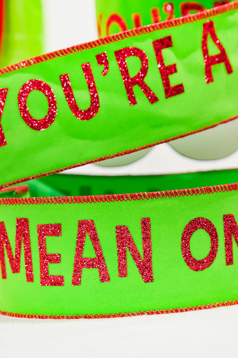 Decorator's Warehouse 2.5" x 10 Yard Green With Red Trim "You're A Mean One" > Christmas Ribbon|Storyville